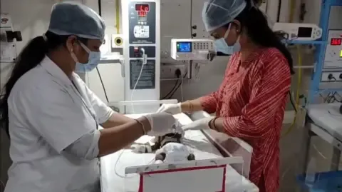 Infant Interred Living in India Battles for Survival